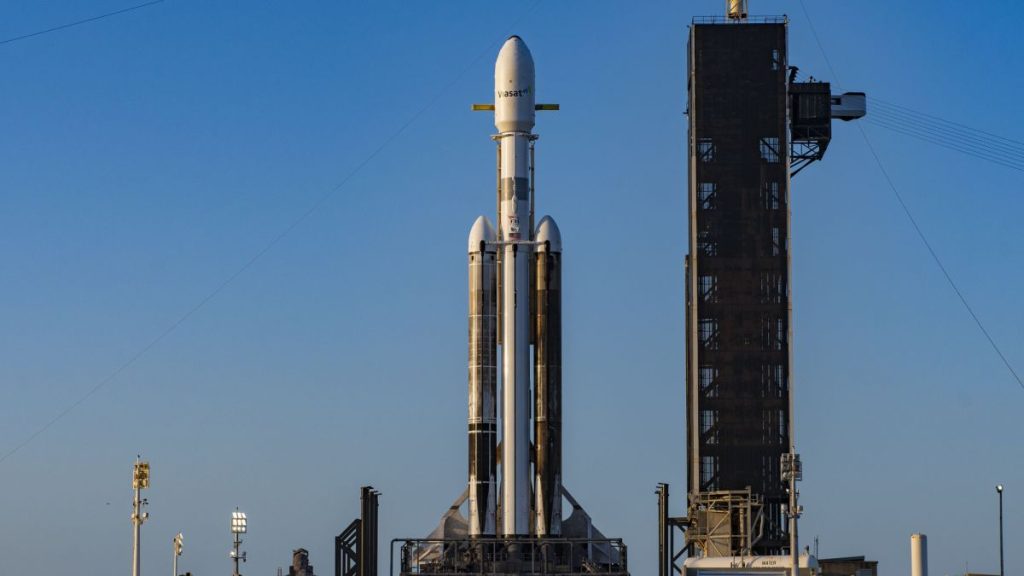A SpaceX Falcon Heavy rocket carrying the ViaSat-3 satellite and other payloads stands atop Pad 39A at NASA