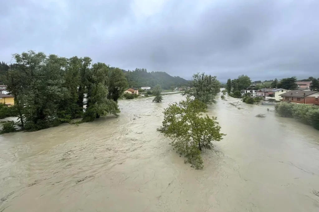 Five dead as torrential rain washed down riverbanks in northern Italy, inundating towns