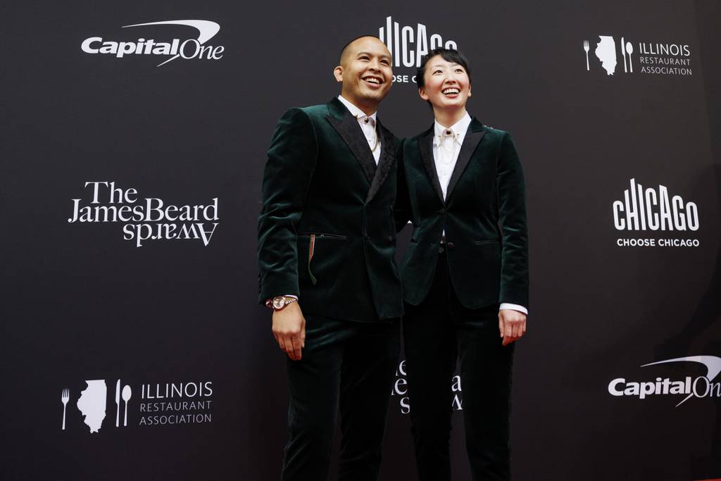 Tim Flores, left, and Kasama's Jennie Kwon walk the red carpet at the James Beard Awards.
