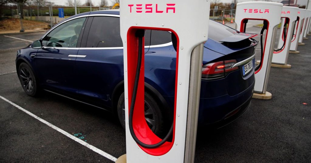 Tesla is jumping as GM's deal moves its Supercharger Network closer to US standards