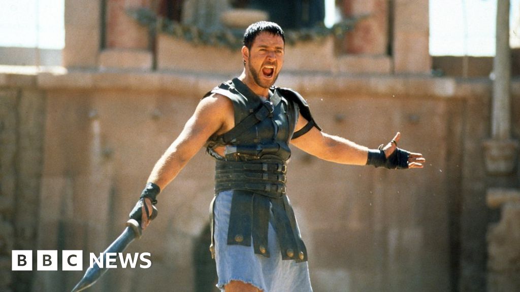 The injured Gladiator sequel crew members perform in a stunt sequence on set