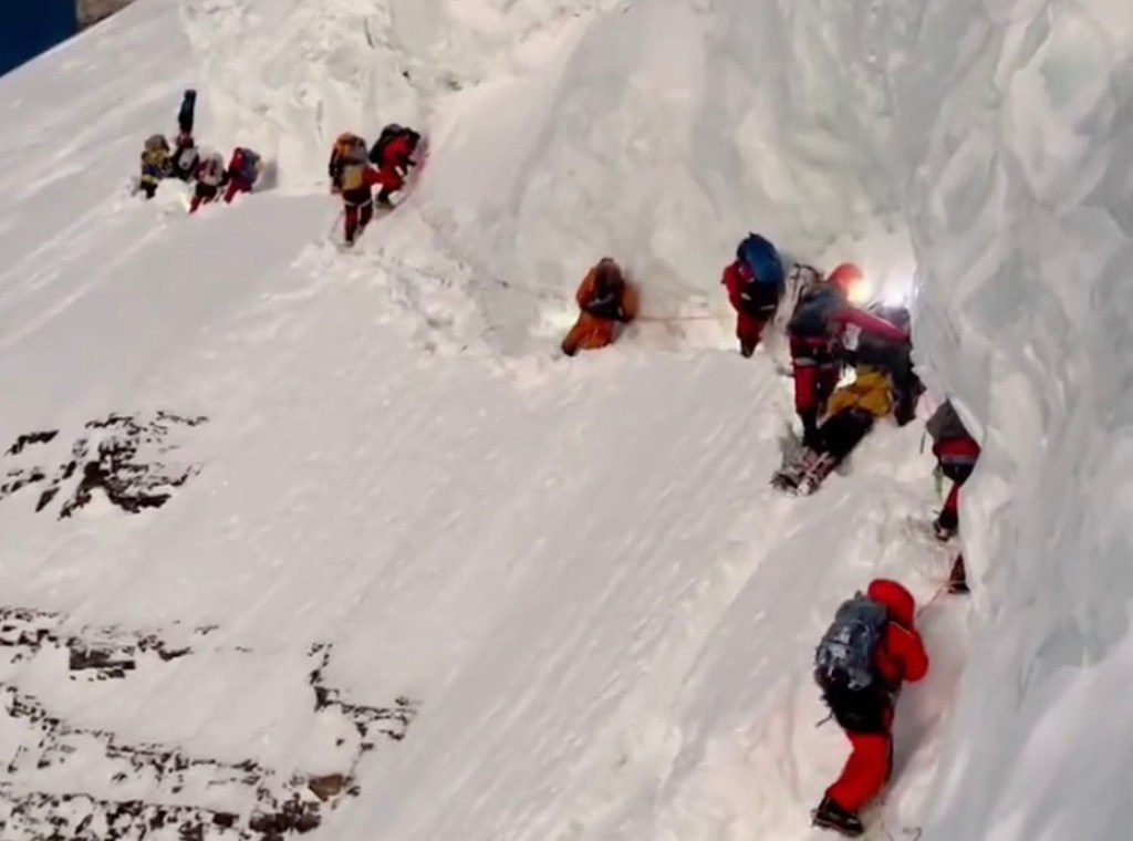 Drone footage released by other climbers showed people walking over the dying porter while a member of the Herila team tended him. 