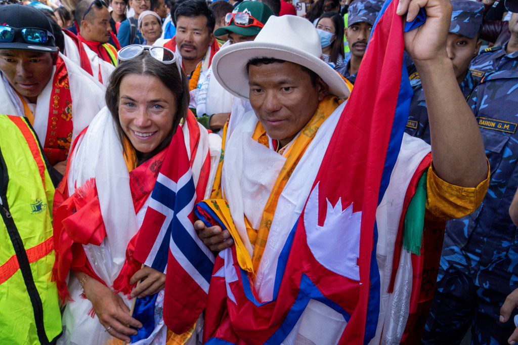 Norwegian climber Kristen Harila, left, and her Nepalese Sherpa guide Tengyn Sherpa, right, who have scaled the world's 14 highest mountains in record time, arrive in Kathmandu, Nepal, on Saturday, August 5, 2023.