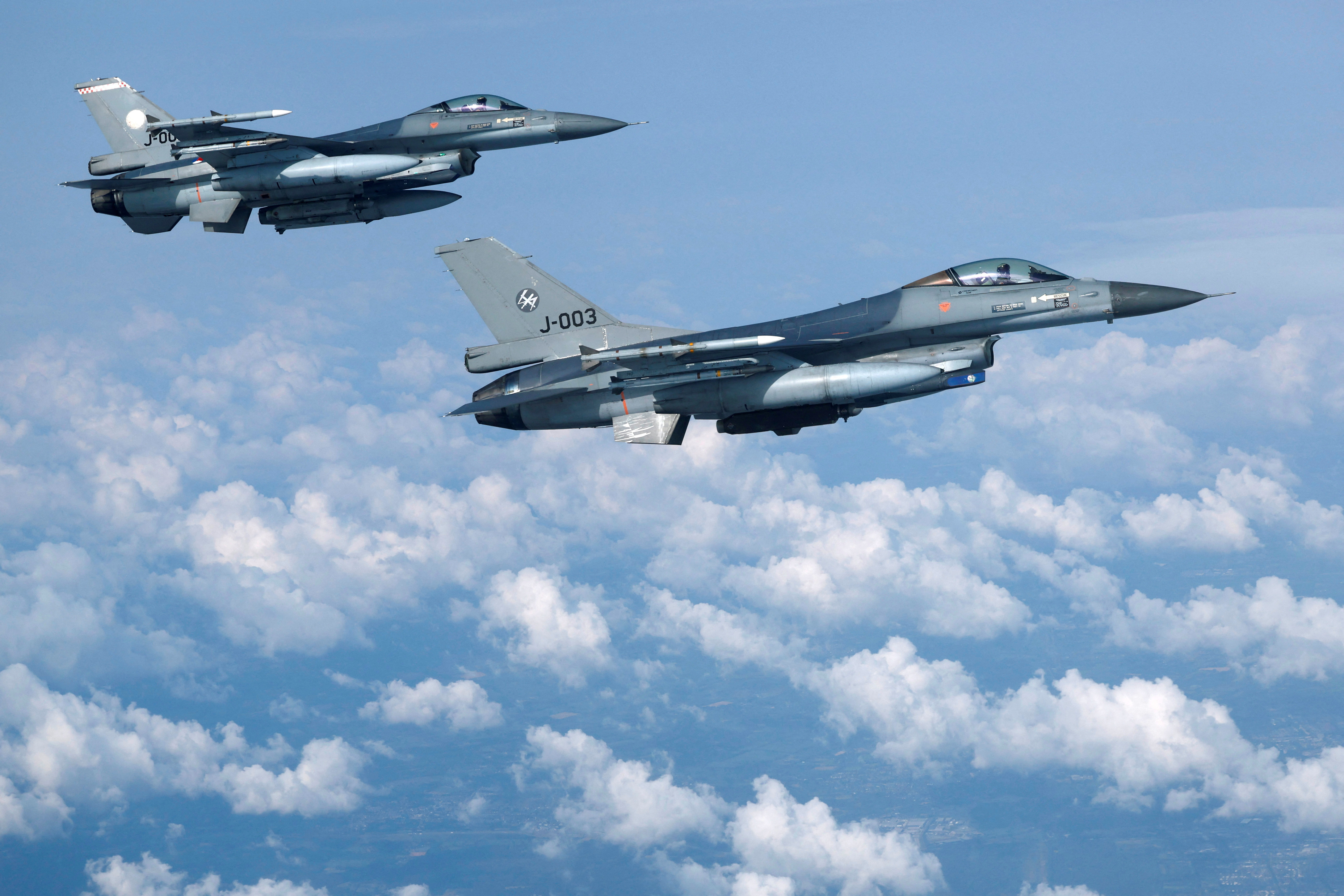 F-16 fighter jets of the Dutch Air Force fly during an information day