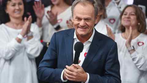 Donald Tusk celebrates opinion poll results during the Polish parliamentary elections on Sunday evening