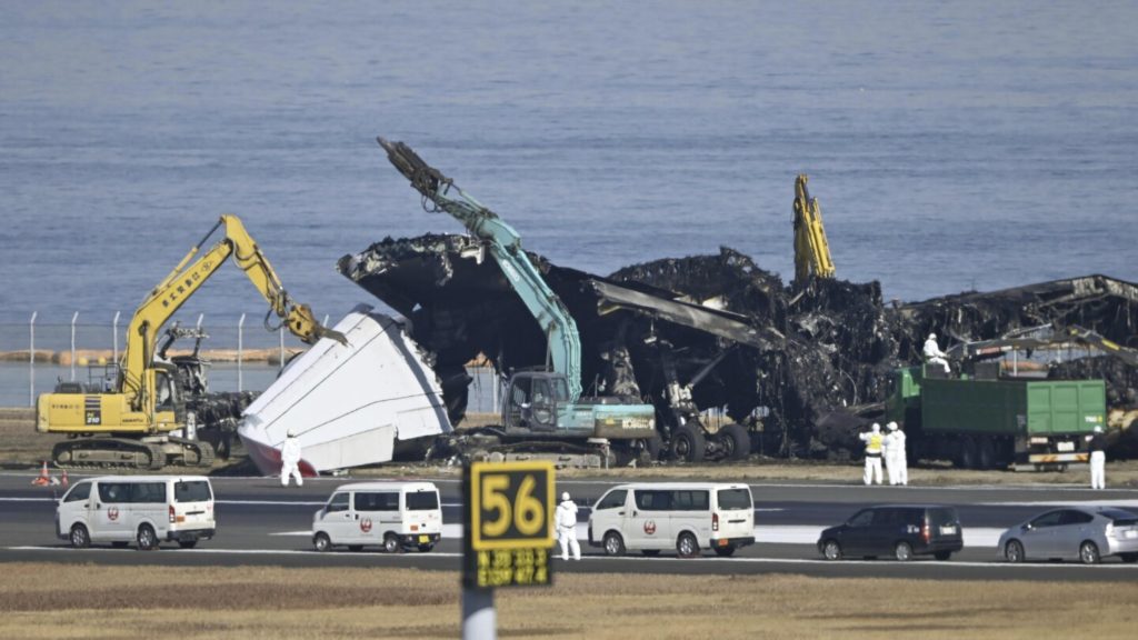 Japanese plane crash: Air safety experts search for audio data from wreckage
