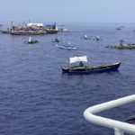 South China Sea: Filipino activists and fishermen sail a flotilla of 100 boats into disputed shoals